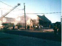 Across the street from the structure fire on the 100 block of 83rd Street allows you to see Ladder Truck 1351 in use