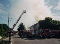 This picture shows a perfect staging setup with proper lay-in from the Engines to the Ladder.  CMCH FD needed assistance on this call in 2003.