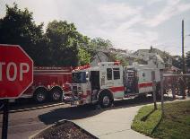 Ladder 1351 assists in the suppression of the structure fire by extending the aerial device many feet